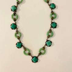 "Such a special piece! A beautifully made necklace made from gilded gold toned filigree brass with jade like insets and linked rings. The whole necklace is 17\" long with ring closure.  There is no hallmark, my best guess this is circa 1940's.  In excellent antique condition. Would make a lovely birthday gift, Christmas gift, Valentine's Day gift. Sold as is. All sales are final, we do not accept returns. Please observe photos carefully as they are a part of the description. Feel free to message Vintage Jade Gemstone Jewelry, Vintage Jade Jewelry For Jewelry Making, Vintage Jade Necklace With Natural Stones, Antique Jade Pendant Necklace, Handmade Vintage Jade Necklaces, Vintage Jade Pendant Jewelry, Handmade Victorian Green Necklaces, Art Deco Jade Jewelry For Formal Occasions, Vintage Green Brass Jewelry