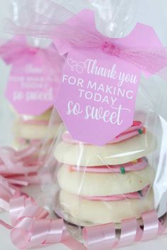 pink and white cookies wrapped in plastic wrapper with thank you for making today so sweet tag