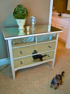 four different pictures of a white dresser with drawers and a small dog on the floor