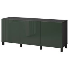 a green cabinet with three doors and black legs