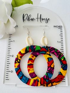 Asana means try it. They are gorgeous Ankara fabric earrings. They are perfect for that special occasion. Please observe the size display pictured for the length of the earrings. These earrings make a perfect gift. This is a show stopping earring. They are perfect for the summer and spring. They are not returnable. Still Shopping please visit our other store and favorite it. Thanks Juanjayzzdesign.Etsy.com Vibrant Multicolor Earrings For Beach, Fabric Earrings Diy, Fabric Jewelry Handmade, Ankara Earrings, Hoop Earrings Diy, Afrocentric Earrings, Denim Earrings, Diy Fabric Jewellery, African Accessories