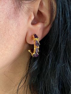 Simply Stylish and Elegant! A gorgeous pair of hoop earrings for gemstone lovers! Purely handmade with love by our skilled Indian craftsmen from Jaipur  Product Details: Material: Handcrafted in brass with a gold-plated base and premium raw amethyst stones. Dimensions: Weight per Pair:  11 grams Length:  3cm Closure Type: Push Back Closure Hoop Earrings With Natural Stones For Gift, Small Hoop Earrings With Natural Stones For Gift, Gold-plated Gemstone Hoop Earrings, Gold Small Hoop Earrings With Gemstones, Gold Hoop Jewelry With Natural Stones, Gold-plated Gemstone Hoop Earrings Gift, Gold Hoop Earrings With Natural Stones, Amethyst Gemstone Hoop Earrings As Gift, Amethyst Hoop Earrings With Gemstone For Gifts