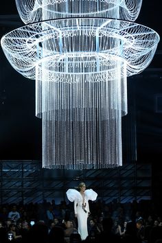 chandelier hanging from the ceiling at a fashion show