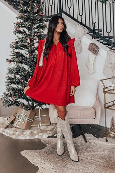 - Kiss your sweetheart under the mistletoe in this darling dress! - Unlined textured material - A ruffled v-cut neckline - A ruffled shoulder detail - Long, loose sleeves with elastic cuffs - A relaxed silhouette that ends in a straight mid-thigh length hemline Red Holiday Dress, Baby Clothes Sale, Christmas Western, Christmas Dresses, Fitted Mini Dress, Loose Sleeves, Ribbed Mini Dress, Darling Dress, Fiery Red