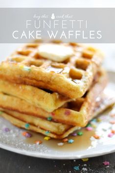 a stack of waffles on a plate with sprinkles