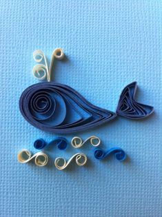 an origami bird made out of blue and white paper on a blue background