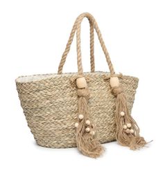 Alden is a great option for a beach, the park, or any other outing! It is made of natural seagrass and includes knotted rope fringe with wood trim. The inside is lined with one zip pocket. Dimensions: 21"L x 11"H x 10"D Knotted Rope, Wood Trim, The Park, Zip Pockets, Trim, Wood, 10 Things