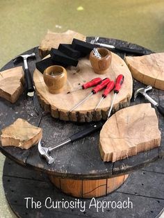 there is a cake made to look like a tree stump with tools and knives on it