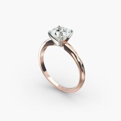 a rose gold engagement ring with a single diamond in the center, on a white background