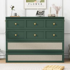 a green dresser with white wicker drawers and gold handles in a living room setting