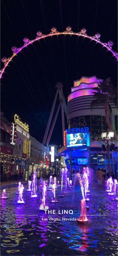 the fountains are lit up at night in las vegas