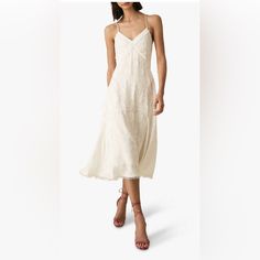 This Reiss Ania Dress Is Ideal For Summer Dressing Or Even As A Contemporary Wedding Dress. The Beautifully Textured Piece Is Lightweight In Design And Forms An A-Line Silhouette That Flatters The Body. With Fringing Detailing On The Bodice And Around The Hem, The Style Is Completed With Delicately Placed Back Straps. Pair With Coloured Heels To Brighten The Look Up. Elegant V-neck Slip Dress For Garden Party, Elegant Lace Slip Dress For Brunch, White Silk Dress With Lace Trim, Elegant White Slip Dress, Casual Lace Midi Dress With V-neck, Coloured Heels, Contemporary Wedding Dress, Summer Dressing, Colorful Heels