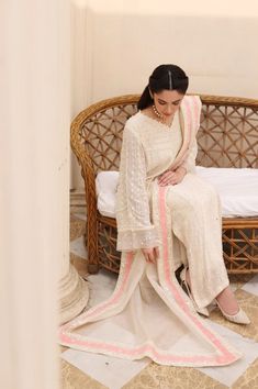 A beautiful three piece on pure embossed net, featuring intricate threadwork alongside clusters of pearls and laces, styled with matching embroidered trousers and embellished pure organza dupatta. Stand out in " Areesha Embossed ". The length of the kameez is 48 inches. Dry clean recommended. Iron the clothes at moderate temperature. Do not use any type of bleach or stain removing chemicals. Actual color may slightly vary from the image shown Organza Lawn Suit With Dabka For Reception, Elegant Cambric Sharara With Traditional Drape, Designer Cambric Palazzo Set With Intricate Embroidery, Wedding Sets With Resham Embroidery On Cambric, Elegant Nida Sharara With Dabka Details, Elegant Dabka Sharara In Nida, Elegant Dabka Embellished Nida Sharara, Elegant Cambric Sharara For Festive Occasions, Elegant Dabka Nida Sharara