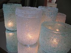 there are many frosted candles on the table