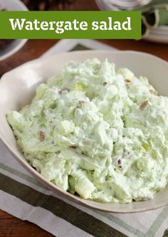 a white bowl filled with food on top of a table