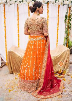 Indian Orange Pink Lehenga Choli for Bridal article is a breathtaking piece of art, handworked to perfection. This extremely gorgeous attire is created keeping in mind the modern bride. Choli: Different variety of materials and techniques are used in the completion of this Indian bridal wear orange-pink lehenga choli. We used pure chiffon and silk fabrics to make this heavily embellished attire. This choli is also heavily embellished from the front and back in heavy stones, zardozi, and mukesh w Raw Silk Traditional Wear With Tilla For Wedding, Floor-length Tilla Gown For Wedding, Wedding Anarkali Set In Raw Silk With Tilla Detailing, Wedding Sharara In Raw Silk With Tilla Details, Wedding Raw Silk Anarkali Set With Tilla, Raw Silk Anarkali Set With Tilla For Wedding, Anarkali Orange Gown For Wedding, Anarkali Wedding Gown With Tilla Embroidery, Anarkali Wedding Gown With Tilla