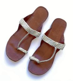 Silver T Strap Sandals Leather Boho StyleFlat Women's Handmade Slip Ons Flip Flops Summer Gift for her Shoes ** WHAT ARE THESE SANDALS CALLED? - Kolhapuri chappals are Indian hand-crafted leather slippers that are locally tanned using vegetable dyes. Kolhapuri Chappals or Kolhapuri s as they are commonly referred to are a style of open-toed, T-strap sandal. ** IMPORTANT POINTS TO NOTE ABOUT THIS PRODUCT -  - Since it does not have a closure at the back it will flap while walking.  - They are suitable for outdoor use.  - It is made for regular feet, not recommended incase of high instep or flat foot ** HOW TO STYLE  - Will go very well with shirts, tees, dresses, skirts, pants and jeans.   ALL ENACHE SANDALS COME IN THE BELOW SIZES FOR WOMEN  US Size 7 - Euro size 37 US Size 7.5 - Euro size Kohlapuri Chappal Women, Fair Trade Round Toe Sandals, Fair Trade Sandals For Summer, Traditional Closed Toe Barefoot Sandals, Kolhapuri Chappals Woman Style, Kolhapuri Chappals, Comfortable Flip Flops, Sandals Outfit, Summer Flip Flops