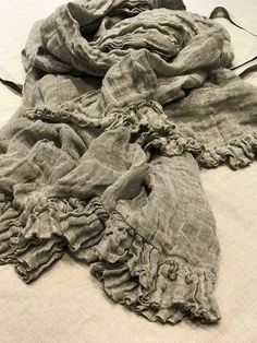 a pile of cloth on top of a bed