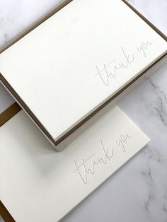 two thank you cards with writing on them