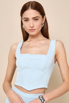 If looking perfect is you aim, then the Lulus Sensational Always Light Blue Corset Crop Top has got you covered! This stunning top is composed of sleek stretch-woven fabric that shapes a sleeveless, bustier-inspired bodice with a trendy square neckline and wide tank straps. The flattering, set-in waist features corset-style seam detailing, before falling to a cropped, pointed hem. Hidden side zipper. Pair with the matching skort for a complete look! Fit: This garment fits true to size. Length: S Chic Fitted Sleeveless Crop Top, Blue Fitted Stretchy Crop Top, Chic Fitted Bodice Top With Bust Darts, Chic Tops With Fitted Bodice And Bust Darts, Blue Sleeveless Padded Blouse, Sleeveless Padded Blouse In Blue, Modern Fitted Tank Top, Fitted Elastane Tank Top For Party, Blue Fitted Elastane Crop Top