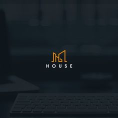 the logo for a house is shown on top of a computer keyboard and monitor screen