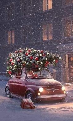 a red car with a christmas tree on the roof