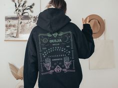 Be comfy and on-trend with this Gothic Aesthetic Hoodie featuring a back print of a pastel ombre Ouija Board. Want this shirt in another color? Send me a message! 👚 PRODUCT Gildan 18500 Unisex Pullover Hoodie *Available in sizes S - 5XL *Classic fit *Runs true to size *Medium-heavy fabric (8.0 oz/yd² (271 g/m *50% cotton, 50% polyester Design is on the back side of Hoodie. There is no design on the front. For an oversized look, go 1-2 sizes larger. All items are made to order. Props & decor sho Pastel Goth Hoodie, Occult Aesthetic, Goth Hoodie, 8 December, Pastel Ombre, Hoodie Back, Aesthetic Hoodie, Ouija Board, Gothic Aesthetic