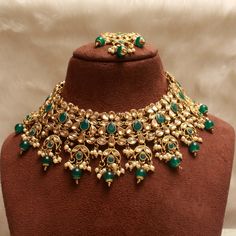 *Light Weight Gold Kundan Adjustable necklace set with earrings and tikka. *Studded with kundan stone. *NO.1- Green *Light Weight Gold kundan necklace. *Necklace width- 2.1 inches (included pearl drop) *Earrings Length- 3 inches(included pearl drop) *Breadth- 1.4 inches *NO.2- Antique gold *Light Weight Gold kundan necklace. *Necklace width- 2.1 inches (included pearl drop) *Earrings Length- 3 inches(included pearl drop) *Breadth- 1.4 inches *NO.3- Pastel green *Light Weight Gold kundan necklace Green Kundan Bridal Necklace For Party, Bollywood Bridal Necklace, Green For Diwali, Bollywood Green Bridal Necklace For Diwali, Bollywood Green Bridal Necklace For Party, Green Bollywood Bridal Necklace For Party, Bollywood Style Green Bridal Necklace For Party, Green Kundan Necklace With Tilla For Party, Heavy Green Kundan Necklace For Party, Green Chandbali Bridal Necklace For Party