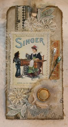 a piece of paper with the words singer on it and an image of a woman at a sewing machine