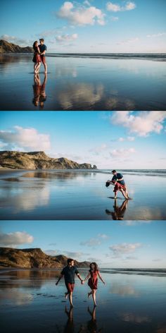 two people holding hands on the beach with water and clouds in the sky behind them