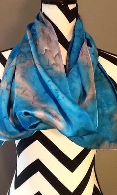 Hand Painted Charmeuse Silk scarf, dyed using a salt effect in blue and gray abstract.This is the Porsche of silks! A muted crepe on the back side and shimmery lustrous satin on the top side. It is heavier and more substantial than plain Satin or Crepe De Chine, has a firm, soft, supple hand and a luxuriously heavy drape. Dyes and paints will show an intensity of color and richness on this fiber. This fabric traditionallyconsidered to be the best of the best, unless you get into the velvets...Th Artistic Hand Dyed Blue Silk Scarf, Blue Bohemian Hand Dyed Silk Scarf, Blue Bohemian Hand-dyed Silk Scarf, Silk Scarf Painting, Mild Shampoo, Silk Wool, Rolled Hem, Business Outfits, Silk Scarf