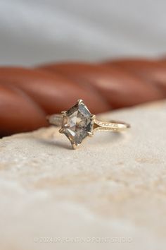 an engagement ring sitting on top of a table