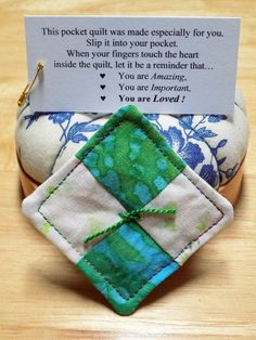 a close up of a pair of shoes with a note on the heel and an ornament