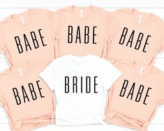 four bridesmaid shirts with the word babe on them in black and white font