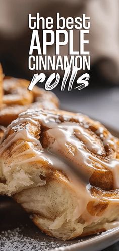 the best apple cinnamon rolls are on a plate with icing drizzled over them