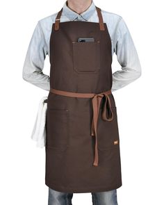 a man wearing an apron with his hands on his hips