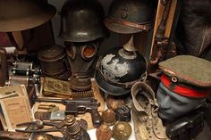 an assortment of helmets and other items on display