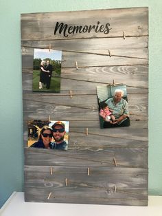 a family photo hanging on a wooden board with clothes pins attached to the pegs