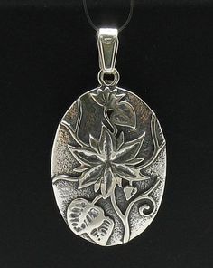 Sterling silver pendant - PE000423. APPROXIMATE WEIGHT 4.7 GRAMSDIMENSIONS 3.0X2.2CM(1.2x0.88inches) All our jewels are made from solid sterling silver 925/1000 and are carefully crafted by hand in our family workshop.We dispatch your orders in 5 working days, worldwide and the postage is $5. We ship registered priority mail. Please allow 5-7 working days for delivery in Europe and 10-15 working days outside Europe.For any questions – please do not hesitate to contact me! Silver Flower-shaped Engraved Jewelry, Silver Engraved Flower Jewelry, Engraved Silver Flower Jewelry, Unique Engraved Flower Jewelry, Sterling Silver Polished Flower Pendant Jewelry, Silver Flower Shaped Locket Jewelry, Silver Flower-shaped Locket Jewelry, Silver Flower Locket Jewelry, Silver Flower-shaped Jewelry With Polished Finish