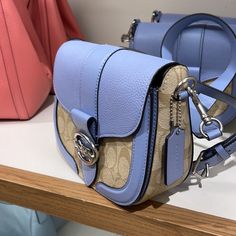 Coach Georgie Saddle Bag In Signature Canvas Light Khaki / Marble Blue Color: Silver / Light Khaki / Marble Blue Signature Coated Canvas, Smooth Leather And Refined Pebble Leather Inside Multifunction Pockets Snap Closure, Fabric Lining Outside Open Pocket Detachable Strap With 20 3/4" Drop For Shoulder Or Crossbody Wear 8 1/4" (L) X 6 3/4" (H) X 2 3/4" (W) Style No. C2806 Georgie Coach Bag, Coach Georgie, Marble Blue, Lighted Canvas, Silver Lights, Signature Canvas, Saddle Bag, Pebbled Leather, Smooth Leather