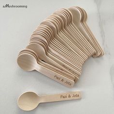 wooden spoons and measuring spoons are arranged on a white countertop with the words past & future engraved on them