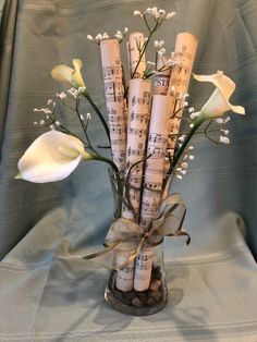 a vase filled with musical notes and flowers