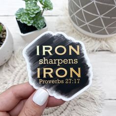 someone holding up a sticker that says iron sharpens iron proves 21 11