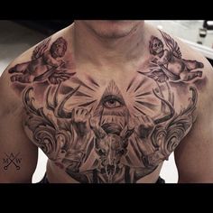 a man with tattoos on his chest has an all seeing eye in the center and other symbols around him