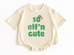 So Elf'in Cute T Shirt Bubble Romper, Christmas Baby Bodysuit, Christmas Baby Outfit, Baby Christmas Shirt, Baby Elf Outfit, Baby Romper 💗  Welcome to The WildflowerbyMiley Etsy Shop!  This listing is for the bodysuit, sweatshirt or t-shirt only. All other items that are shown in our photos such as shoes, hats, beanies, blankets etc. are for photo staging purposes and are NOT INCLUDED in the sale. DESCRIPTION:  This baby and children's unisex essential fits like a well-loved favorite. Super soft t-shirts, sweatshirts and baby bodysuits for your little lads and gals meant to showcase their big personalities. Its Excellent quality and vibrant print makes one fall in love with it over and over again.  This adorable piece is the perfect lightweight layer for casual wearing.  This product is h Baby Christmas Shirts, Baby Christmas Onesie, Baby Christmas Shirt, Elf Outfit, Baby Elf, Christmas Onesie, Elf Clothes, Baby Christmas Outfit, Baby Christmas