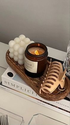 a candle and some candles on a tray