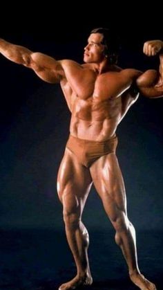 a man with muscles flexing his arms and legs