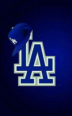 a los angeles dodgers baseball cap on top of the los angeles angels'blue and white logo