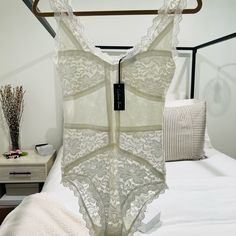 New Beautiful Lace Body Suit Stretchy Material. Lace Shapewear Bodysuit Fitted, Fitted Lace Shapewear Bodysuit, Elegant Lined Bodysuit For Loungewear, Elegant White Underwire Bodysuit, White Fitted Bodysuit For Daywear, Lined Body Shapewear For Daywear, Spring Shapewear With Lined Body, Clear Strap Bra, Lace Body Suit