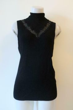 Find Womens Elie Tahari Cheresia Black Sleeveless Wool Sweater L on eBay in the category Clothing, Shoes & Accessories>Women>Women's Clothing>Sweaters. Elegant Fitted Tank Sweater Vest, Fitted Elegant Tank Sweater Vest, Elegant Stretch V-neck Vest, Elegant Stretch Sweater Vest For Spring, Elegant Sleeveless Stretch Vest, Elegant Stretch Tank Vest, Elegant Stretch Sleeveless Vest, Elegant Stretch Vest, Elegant Fitted Winter Tank Top